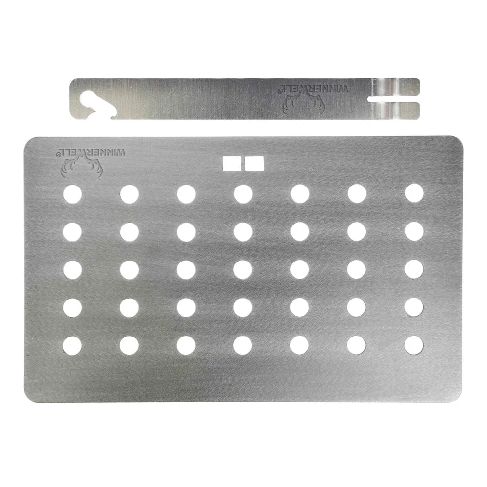 Plaque grill Winnerwell avec le manche détaché au-dessus de la plaque perforée