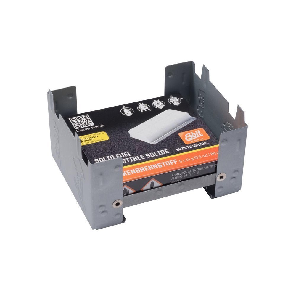 Réchaud Esbit Survival Stove déplié avec une boîte de tablettes de combustible à l'intérieur