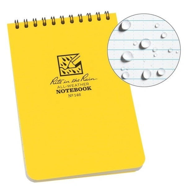 carnet à spirale Rite in the Rain jaune avec gouttes d'eau sur le papier ligné