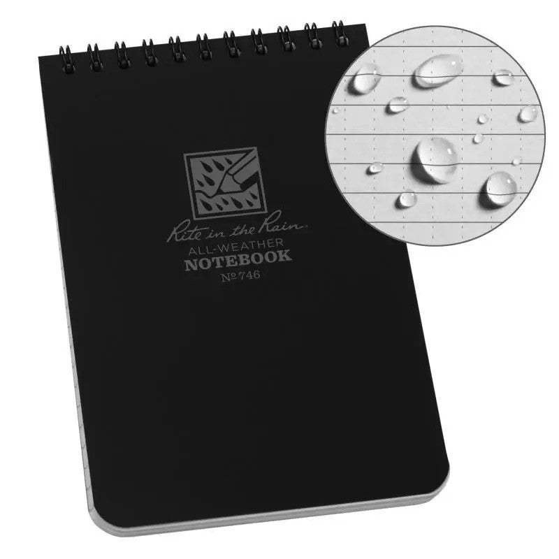 Carnet Rite in the Rain noir à spirale, à côté des gouttes d'eau sur le papier