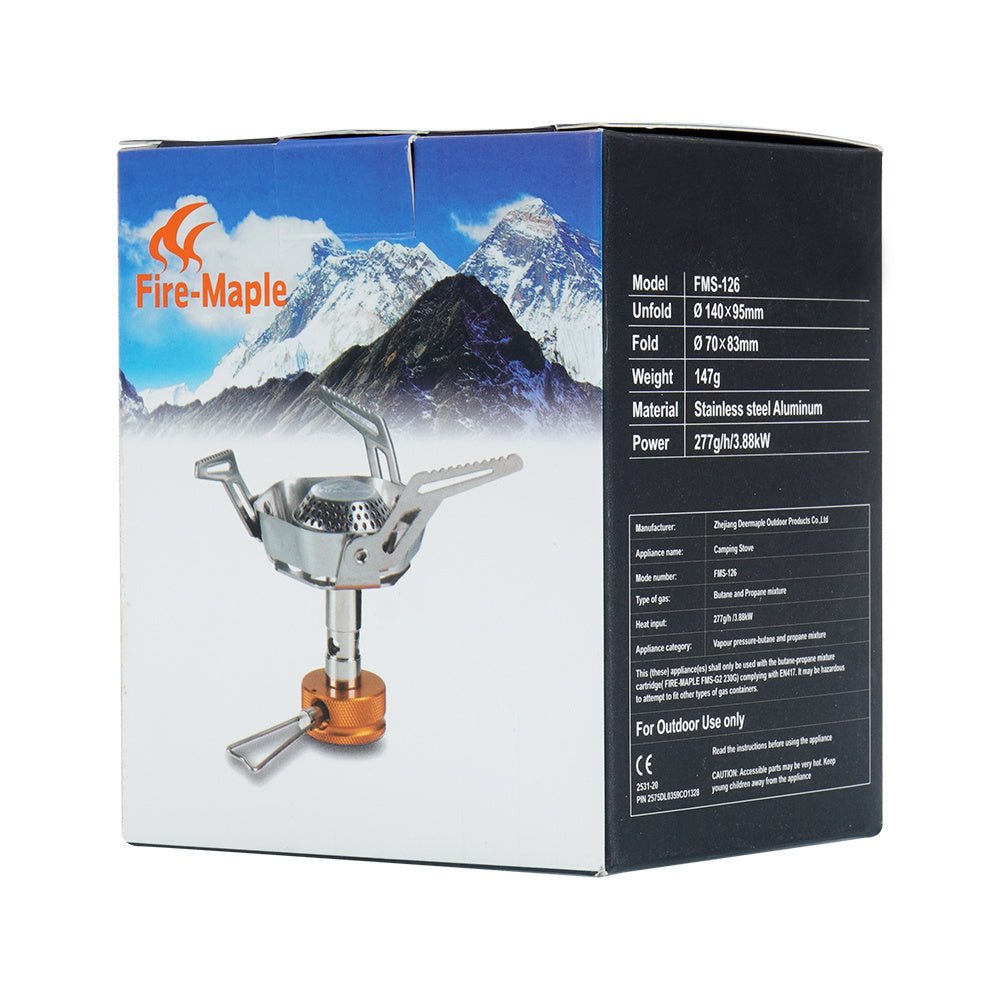 Emballage Fire Maple FMS-126 avec le brûleur et un paysage de montagne enneigé sur la boîte