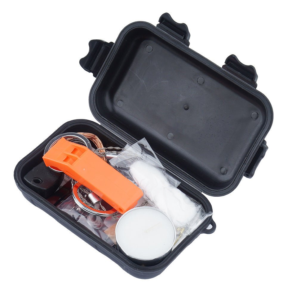 Fosco Combat Survival Kit, boîte noire ouverte avec sifflet orange, bougie chauffe-plat et coton