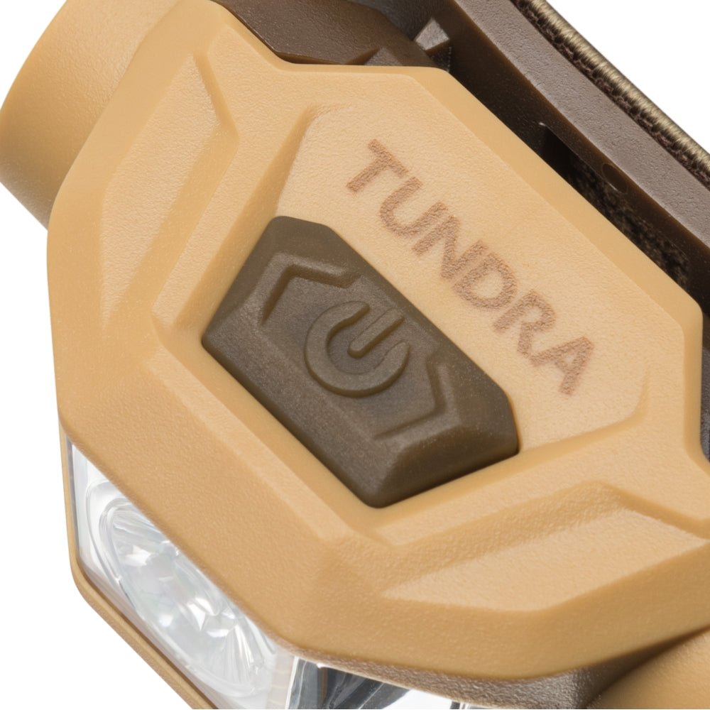 Mactronic Tundra bouton marche-arrêt sur le dessus de la lampe frontale avec l'inscription Tundra