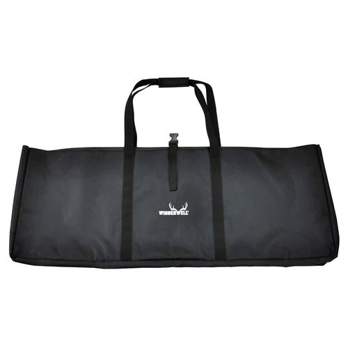 Winnerwell Fire Guard Stove Table rangée dans un sac de transport noir avec anses et logo