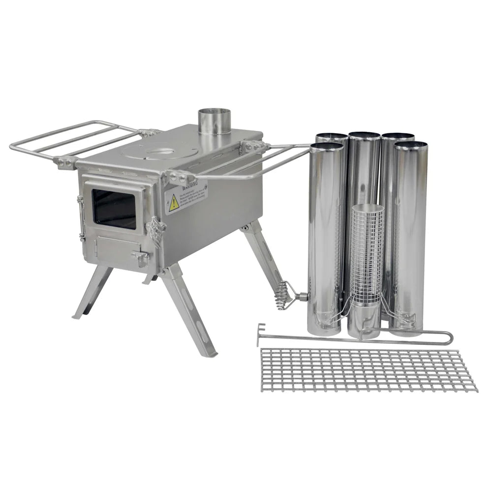 Poêle Winnerwell Nomad avec autocollant d'avertissement sur le côté, tuyaux et grille à côté